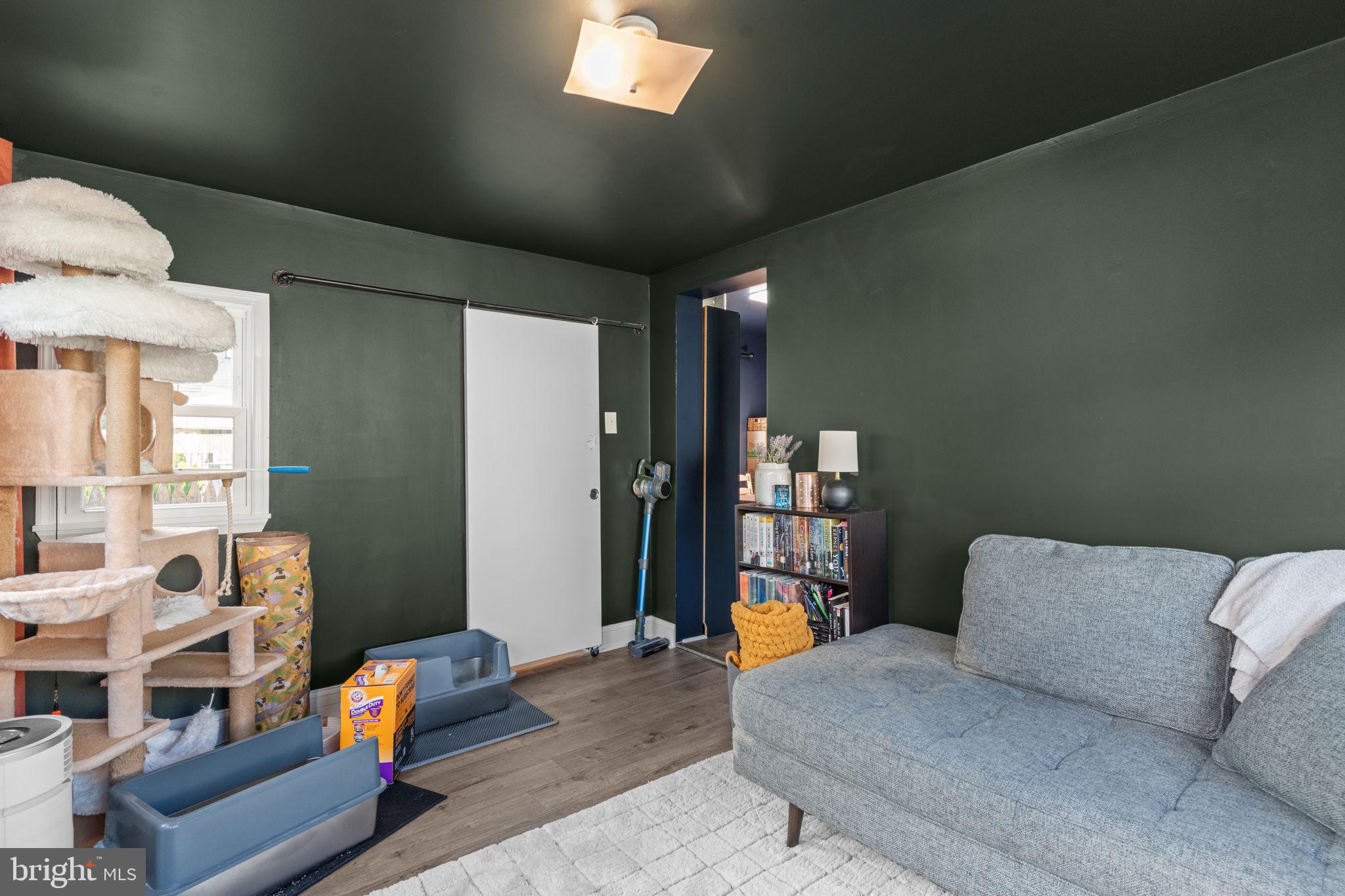 2114 Redwood Avenue Upper Chichester, PA 19061 - Photo 8 of 33 a living room with furniture and a wooden floor