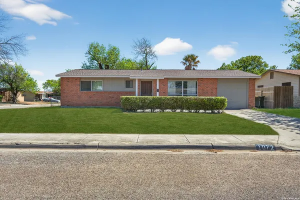 front view of house that has a yard