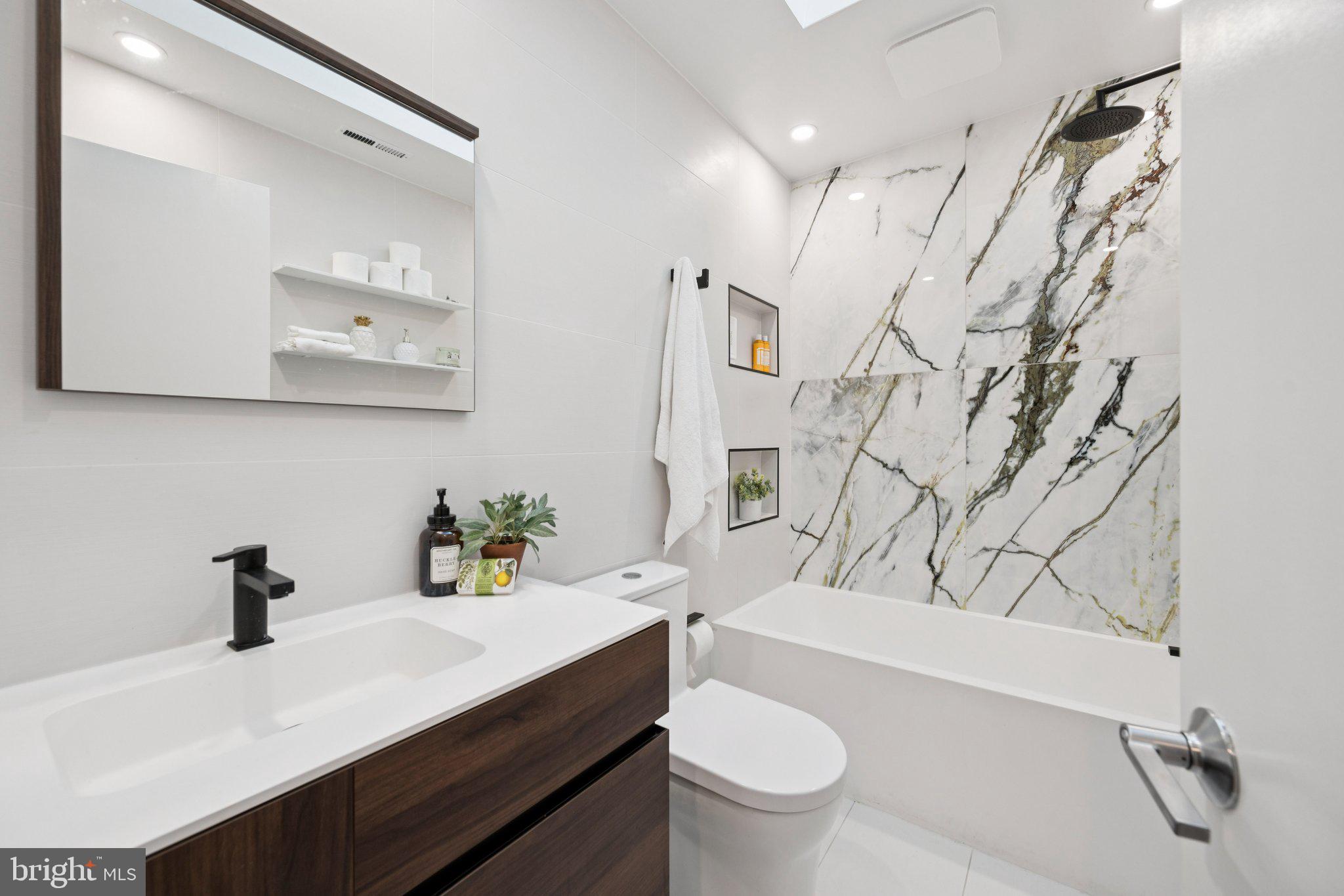 6 Spring Hill Court Chevy Chase, MD 20815 - Photo 16 of 26 Porcelanosa Renovated Hall Bathroom
