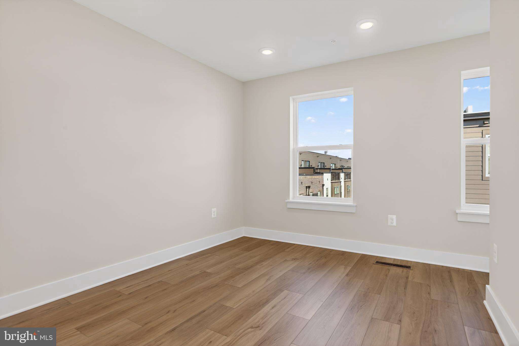 2717 Light Street Baltimore, MD 21230 - Photo 16 of 20 a view of an empty room with wooden floor and a window