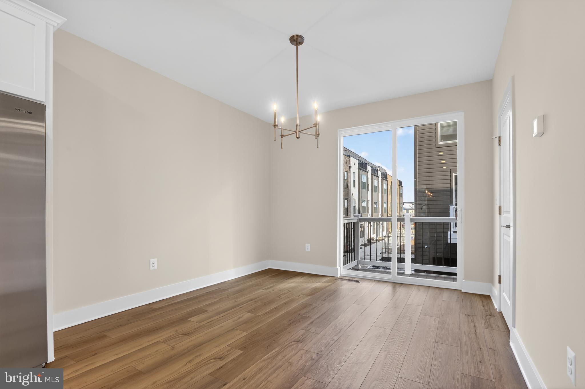 2717 Light Street Baltimore, MD 21230 - Photo 8 of 20 wooden floor in an empty room with a window