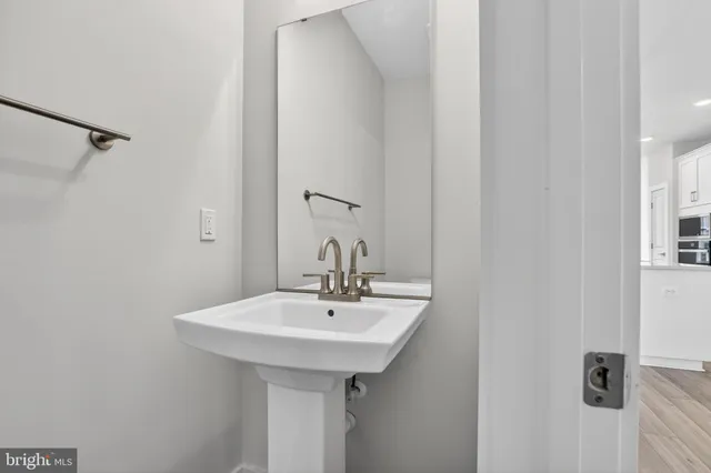 a bathroom with a sink and mirror