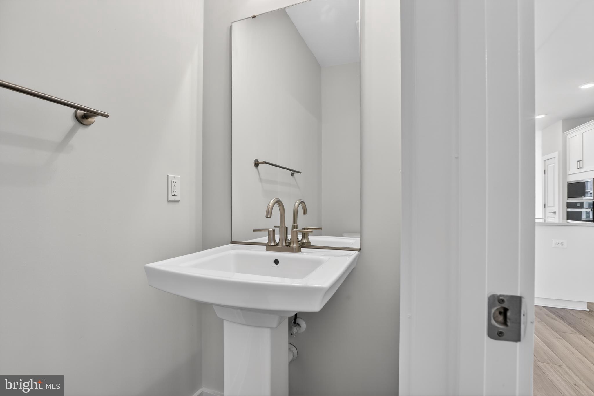 2717 Light Street Baltimore, MD 21230 - Photo 9 of 20 a bathroom with a sink and mirror