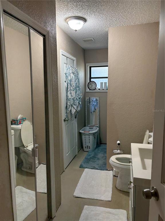 2203 Lime Tree Drive Edgewater, FL 32141 - Photo 5 of 10 a bathroom with a toilet and a shower