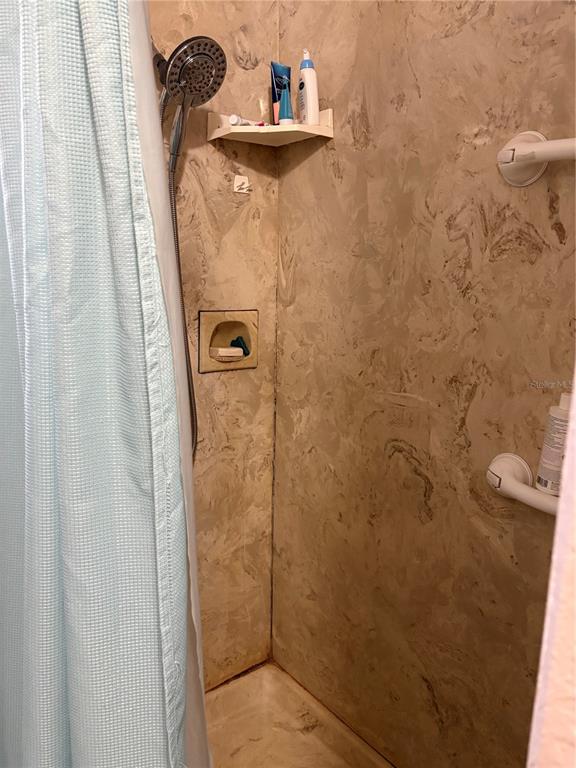 2203 Lime Tree Drive Edgewater, FL 32141 - Photo 6 of 10 a bathroom with a shower