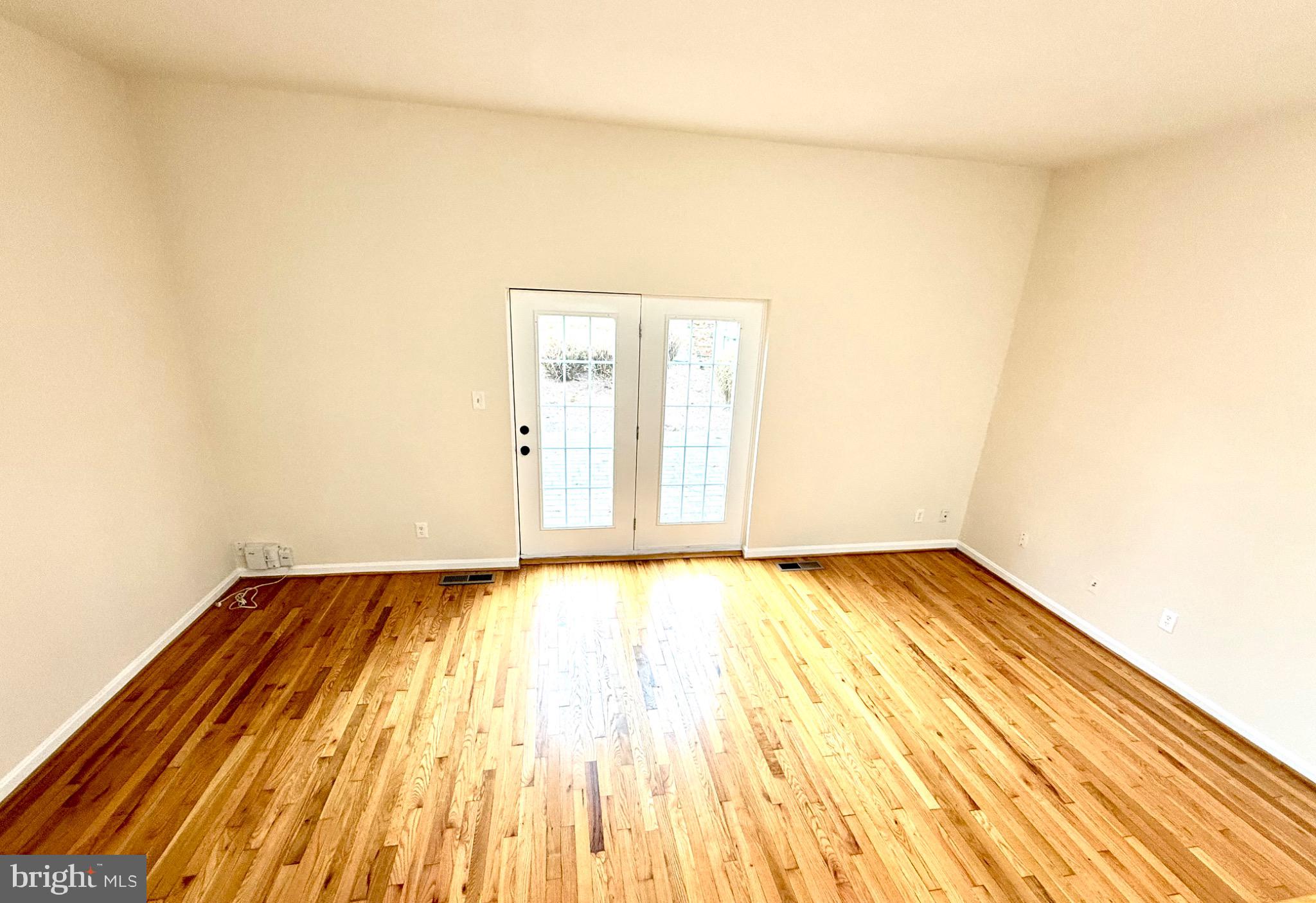 2196 Golf Course Drive Reston, VA 20191 - Photo 13 of 16 a view of an empty room and wooden floor