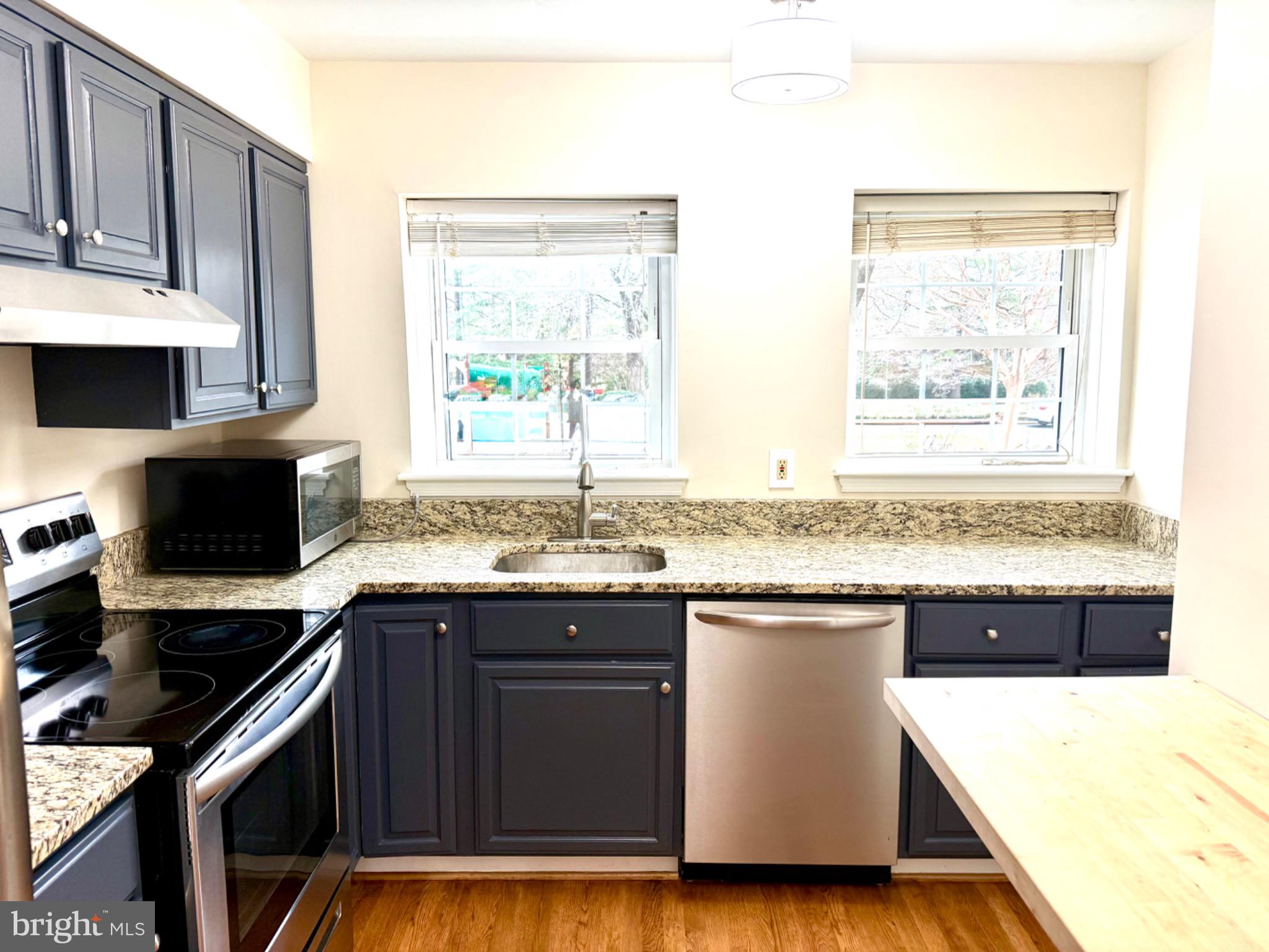 2196 Golf Course Drive Reston, VA 20191 - Photo 4 of 16 a kitchen with a sink and a stove