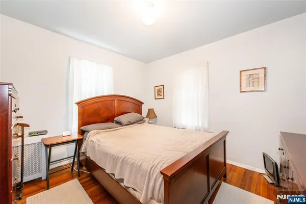 a bedroom with a bed and a desk