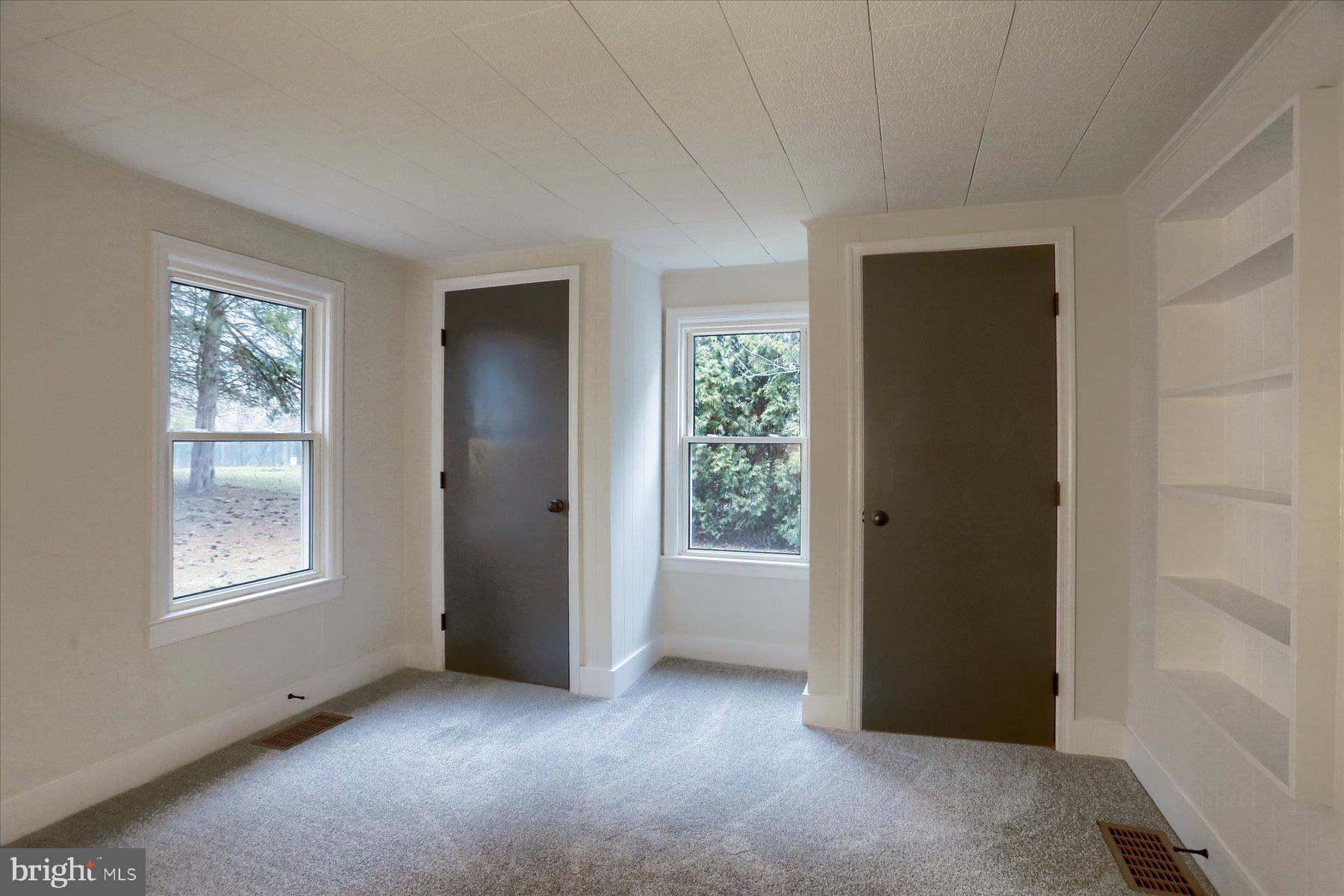 960 Butter Road Dover, PA 17315 - Photo 13 of 48 an empty room with windows and closet
