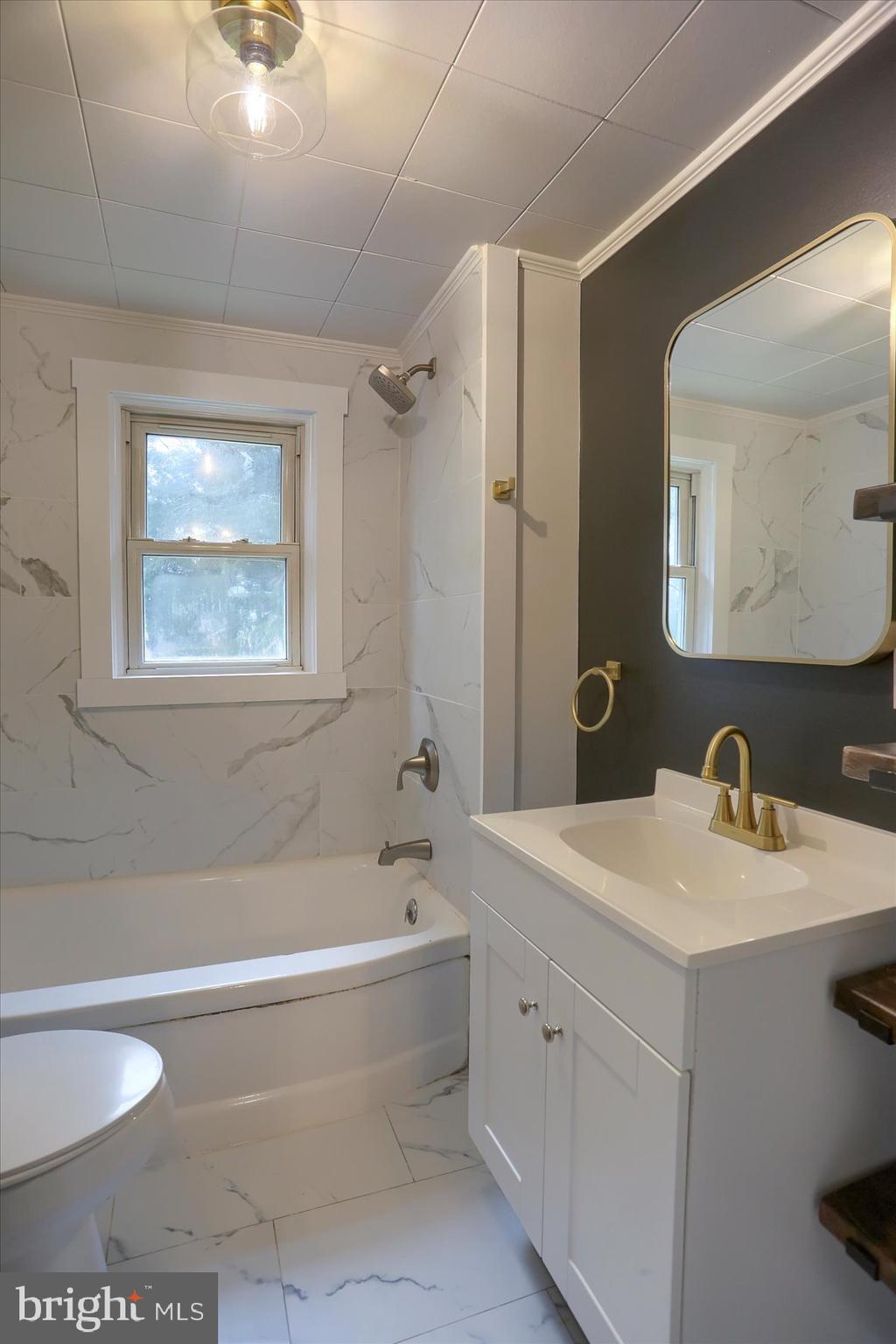 960 Butter Road Dover, PA 17315 - Photo 18 of 48 a bathroom with a tub a sink and mirror