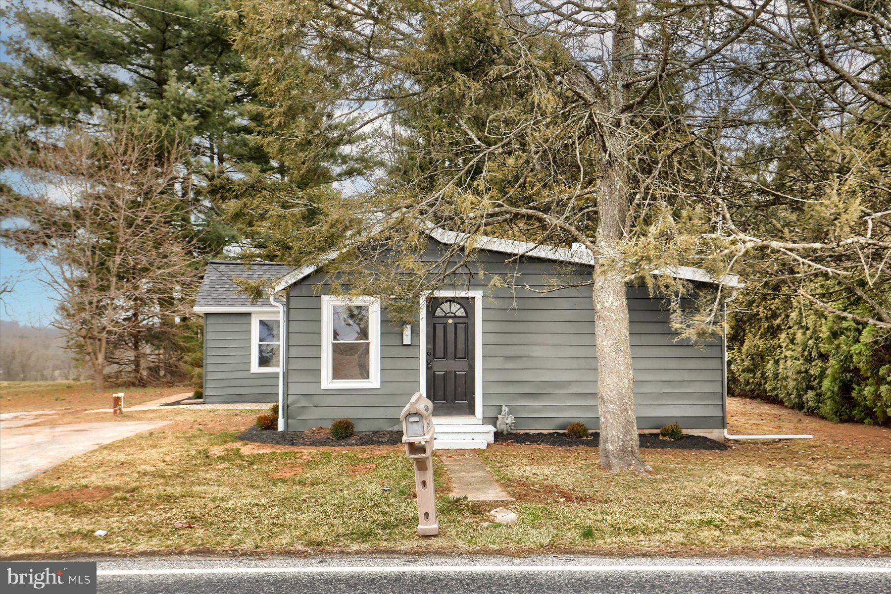 960 Butter Road Dover, PA 17315 - Photo 25 of 48 a front view of a house with a yard