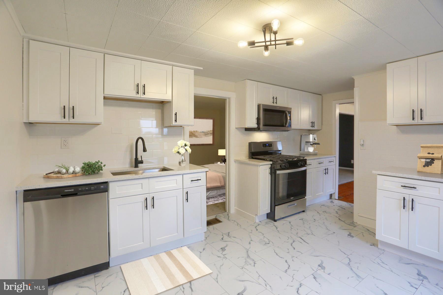 960 Butter Road Dover, PA 17315 - Photo 8 of 48 a kitchen with white cabinets and appliances