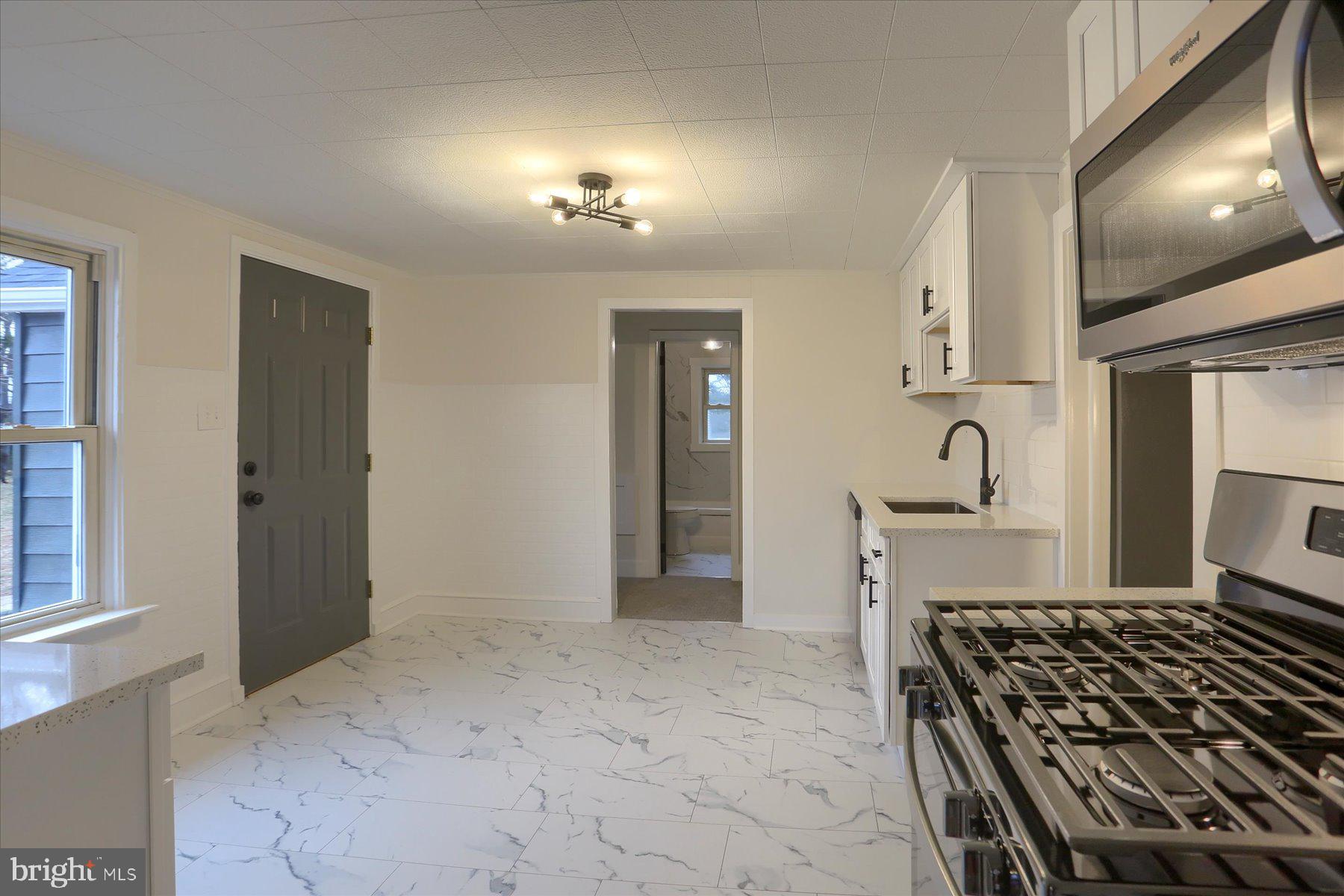 960 Butter Road Dover, PA 17315 - Photo 9 of 48 a kitchen with granite countertop a stove and a refrigerator