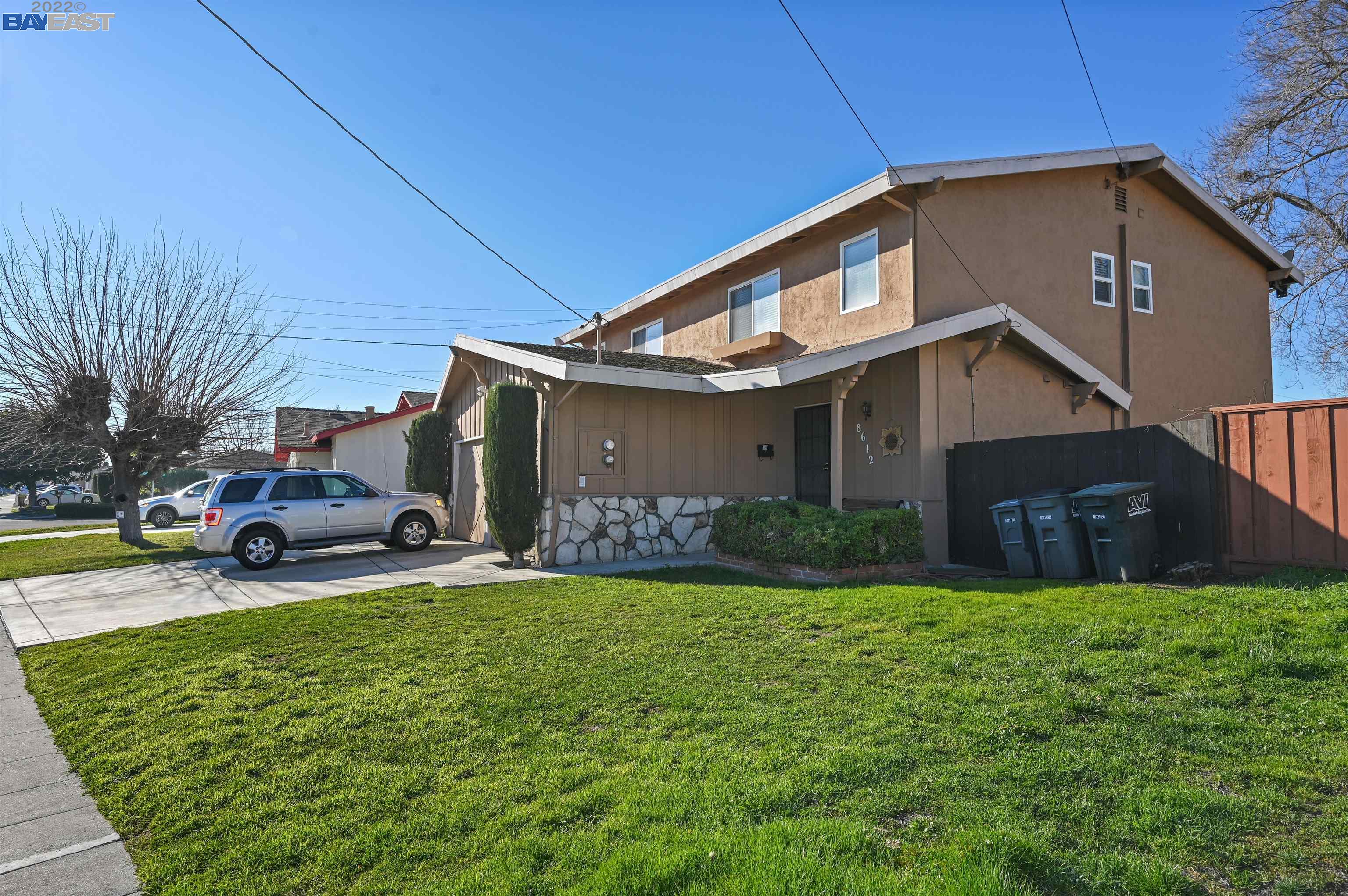 8610 Beverly Lane Dublin, CA 94568 - Photo 1 of 1 a front view of a house with a yard and garage