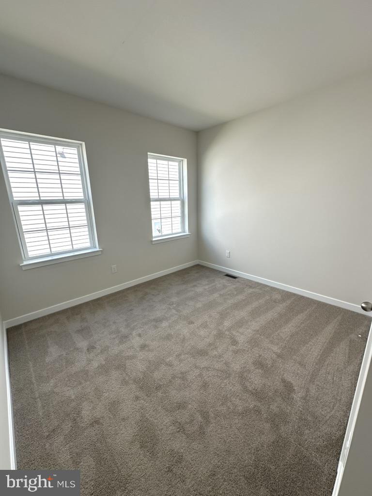 1019 Robinson Road Townsend, DE 19734 - Photo 3 of 13 an empty room with windows