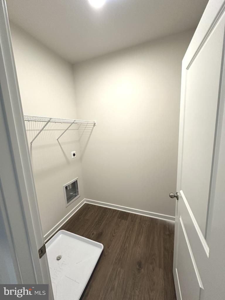 1019 Robinson Road Townsend, DE 19734 - Photo 6 of 13 an empty room with wooden floor and white walls