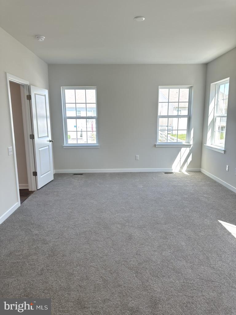 1019 Robinson Road Townsend, DE 19734 - Photo 8 of 13 a view of an empty room with a window