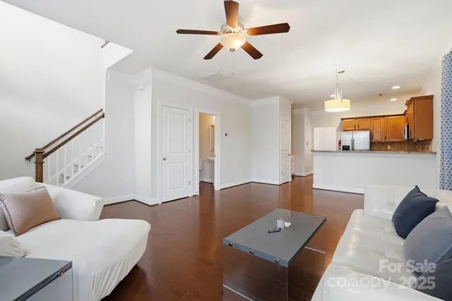 a kitchen with stainless steel appliances granite countertop a refrigerator a stove top oven a sink and dishwasher