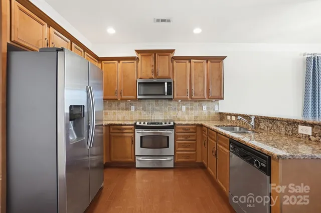 a kitchen with a stove and a microwave