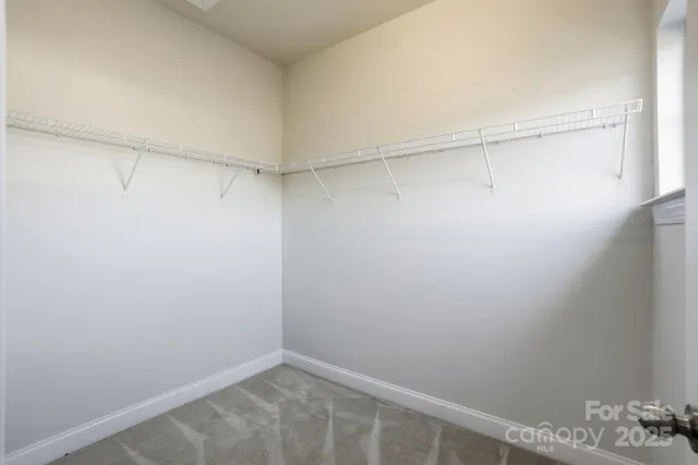 a bathroom with double vanity sinks and a mirror