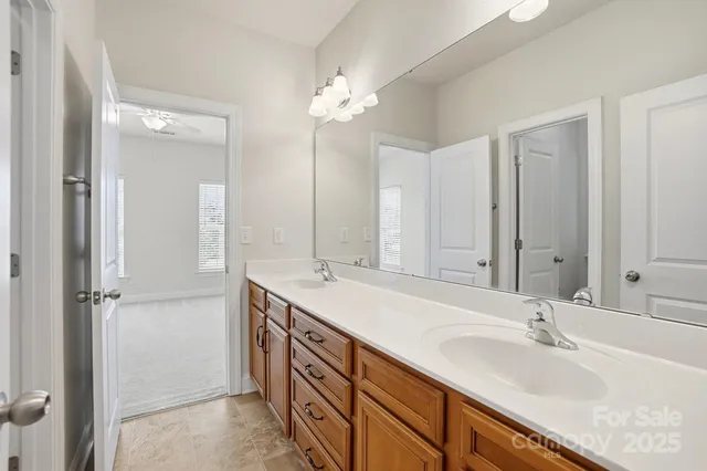 a white toilet sitting next to a white sink