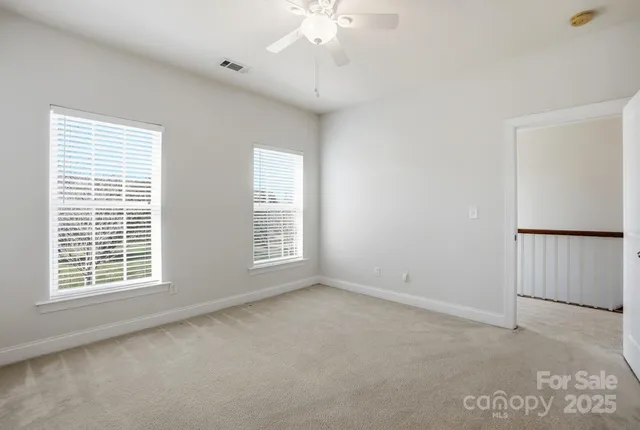 a view of an empty room with a bathroom