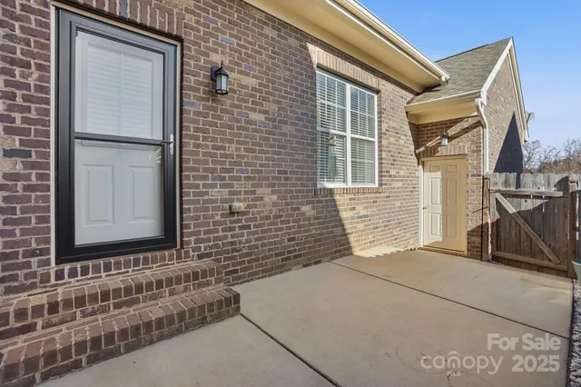 a view of a brick house with many windows