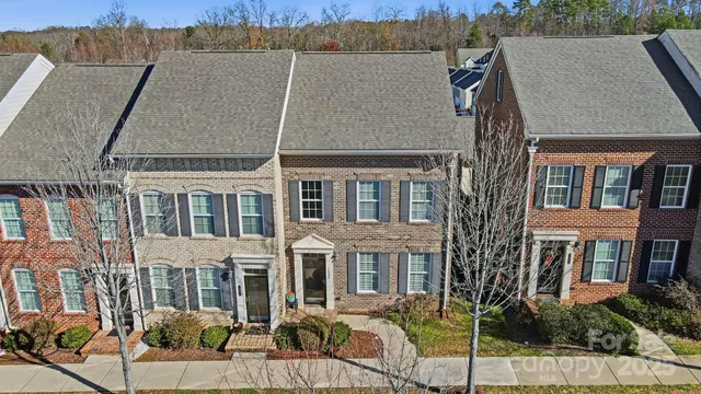 a view of a town with mountains in the background