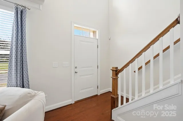 a view of staircase with wooden floor