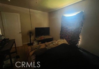 2238 Wood Street Merced, CA 95340 - Photo 11 of 15 a bedroom with a bed and a television