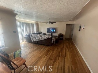 2238 Wood Street Merced, CA 95340 - Photo 4 of 15 a living room with furniture and a wooden floor