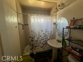 a bathroom with a sink and mirror