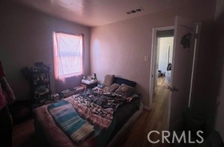2238 Wood Street Merced, CA 95340 - Photo 10 of 15 a bed sitting in a bedroom next to a window