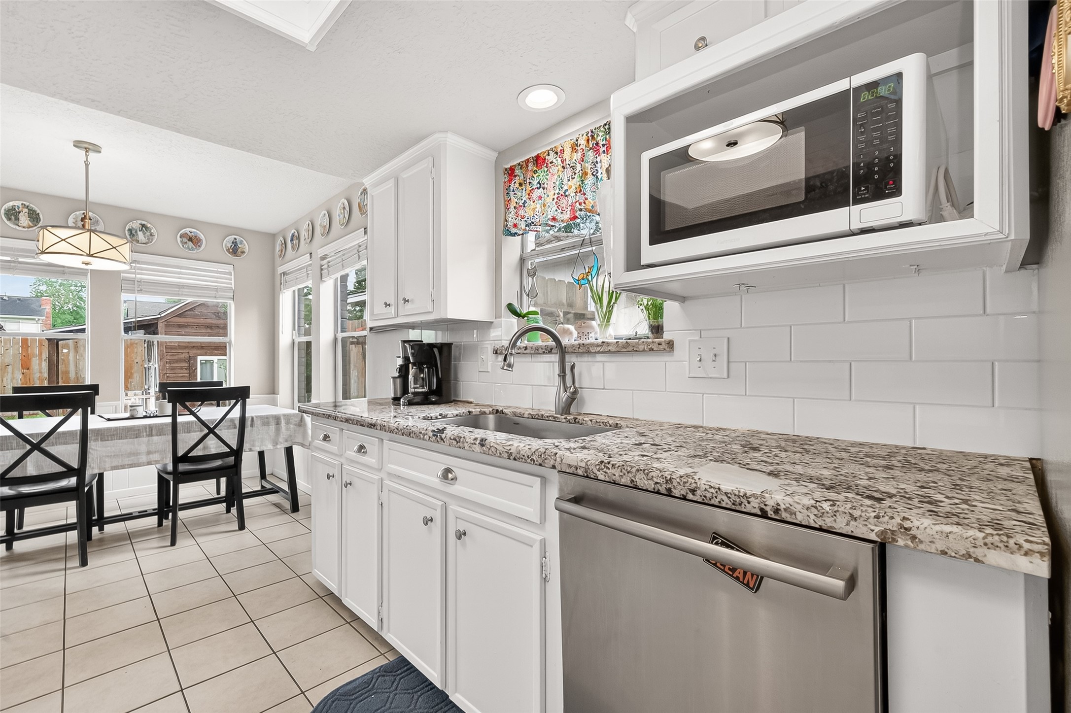 17611 Sorrell Ridge Drive Spring, TX 77388 - Photo 26 of 50 a kitchen with stainless steel appliances granite countertop a sink and cabinets