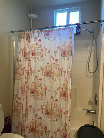 a kitchen with a table chairs sink and cabinets