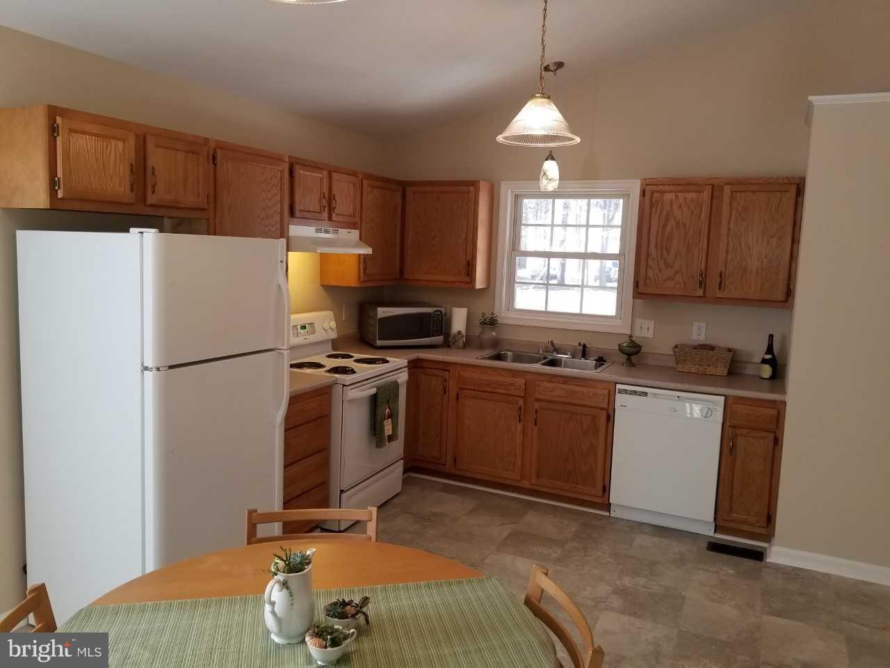 328 12th Street Colonial Beach, VA 22443 - Photo 11 of 17 a kitchen with a refrigerator stove and microwave