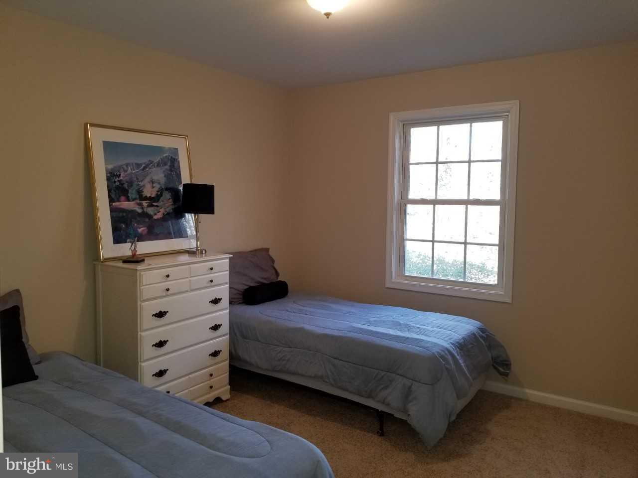 328 12th Street Colonial Beach, VA 22443 - Photo 16 of 17 a bedroom with a bed and a window