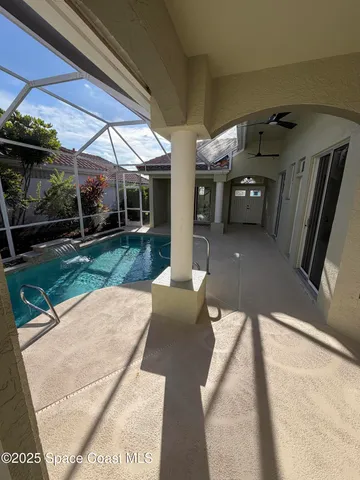 a view of a patio with table and chairs potted plants with wooden floor
