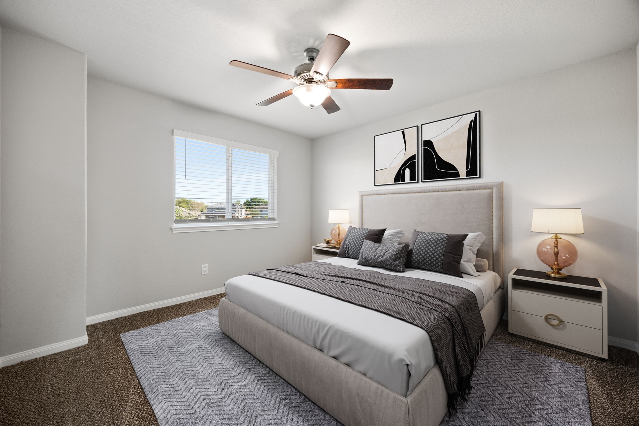 18606 Lansdowne Stream Path Katy, TX 77449 - Photo 13 of 39 a bedroom with a large bed and a chandelier