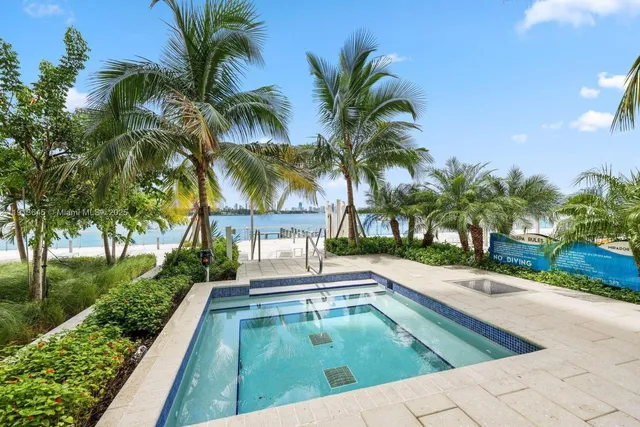 a swimming pool with palm trees