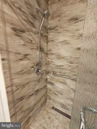 a view of an empty room and a window