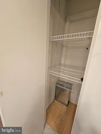 a view of an empty room with windows