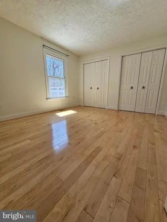 a bathroom with a glass door shower