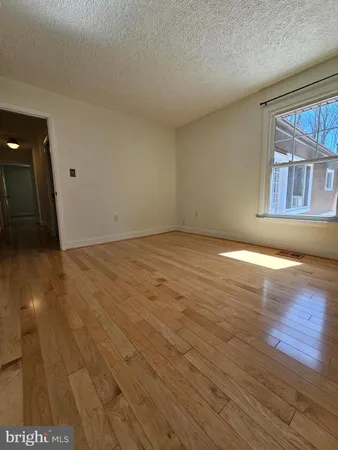 a white toilet sitting next to a shower