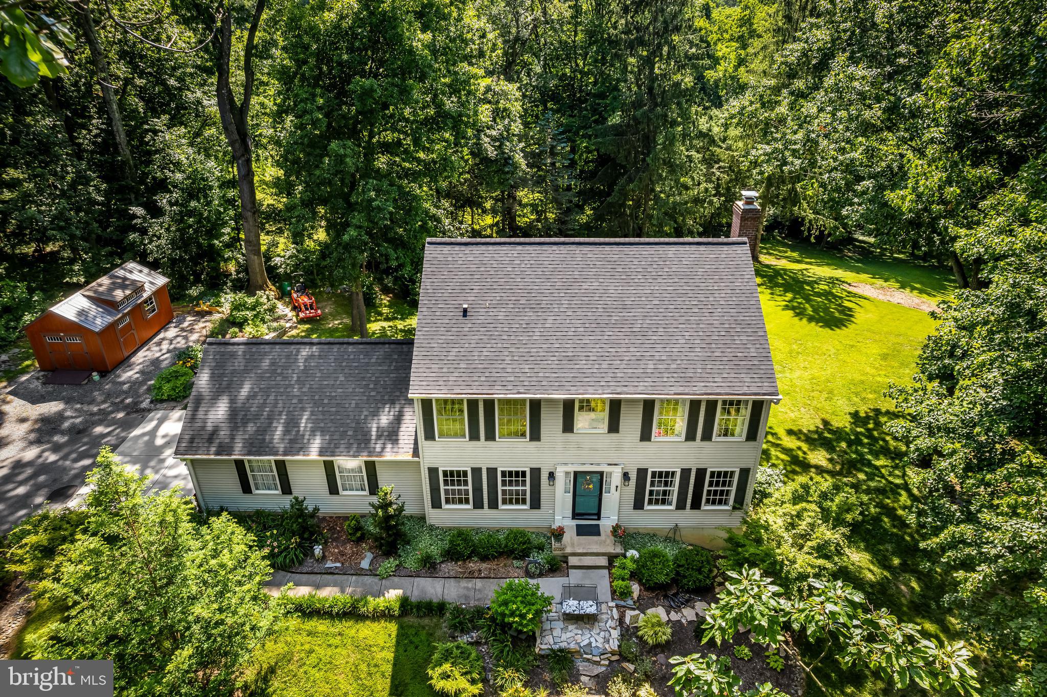 5026 Mt Carmel Road Hampstead, MD 21074 - Photo 47 of 57 an aerial view of a house with swimming pool and large trees