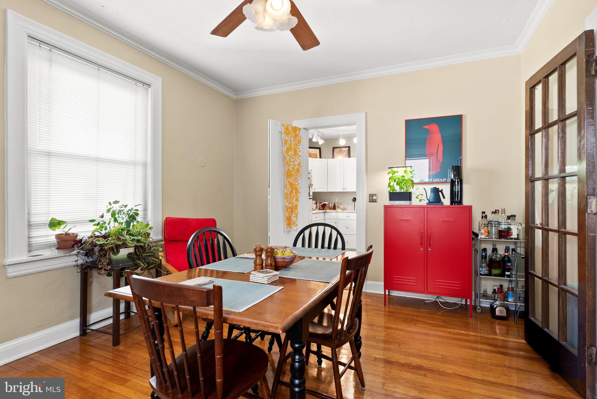 3405 Greenway, Unit 302 Baltimore, MD 21218 - Photo 20 of 42 a view of a dining room with furniture window and wooden floor