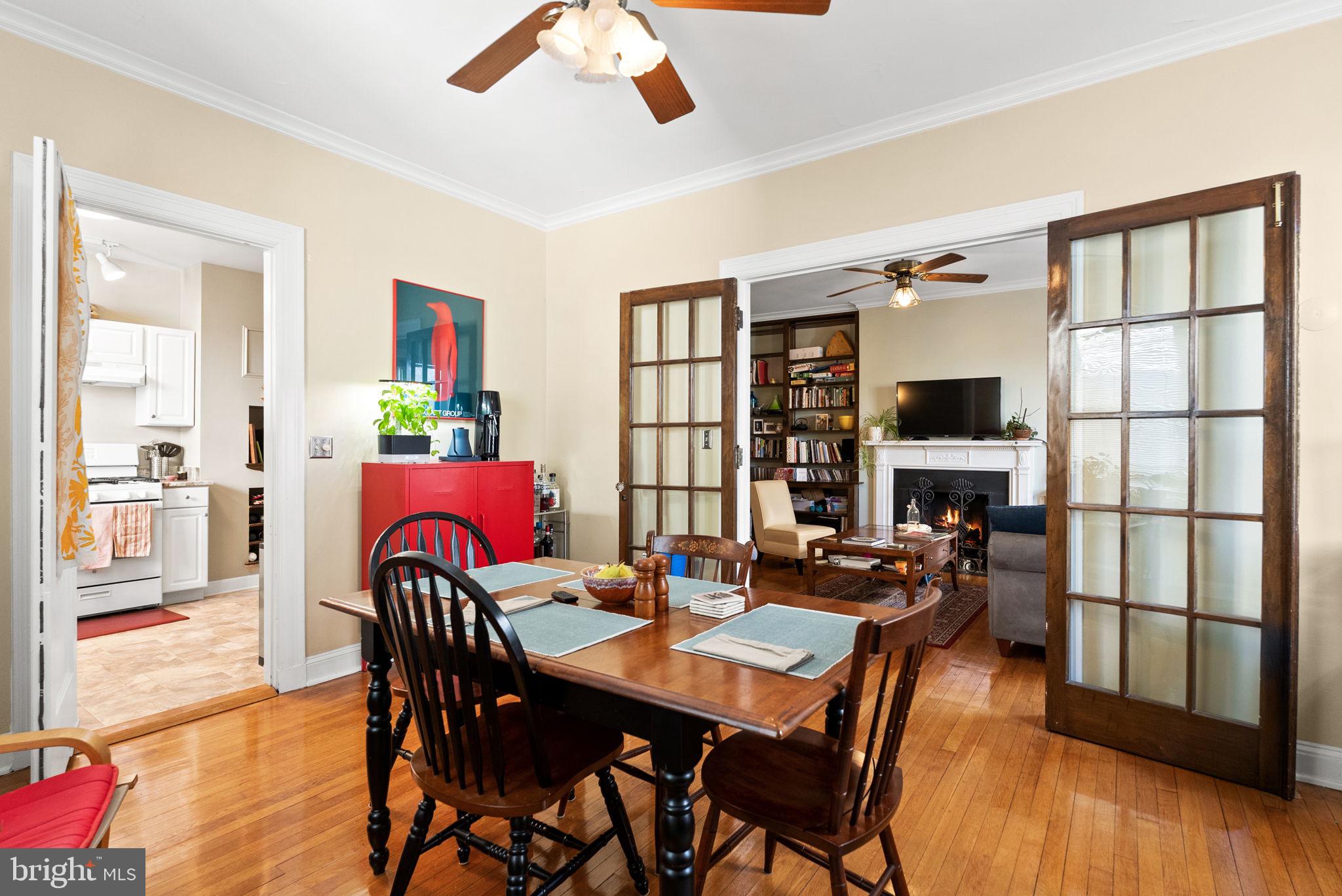 3405 Greenway, Unit 302 Baltimore, MD 21218 - Photo 21 of 42 a view of a dining room with furniture window and wooden floor