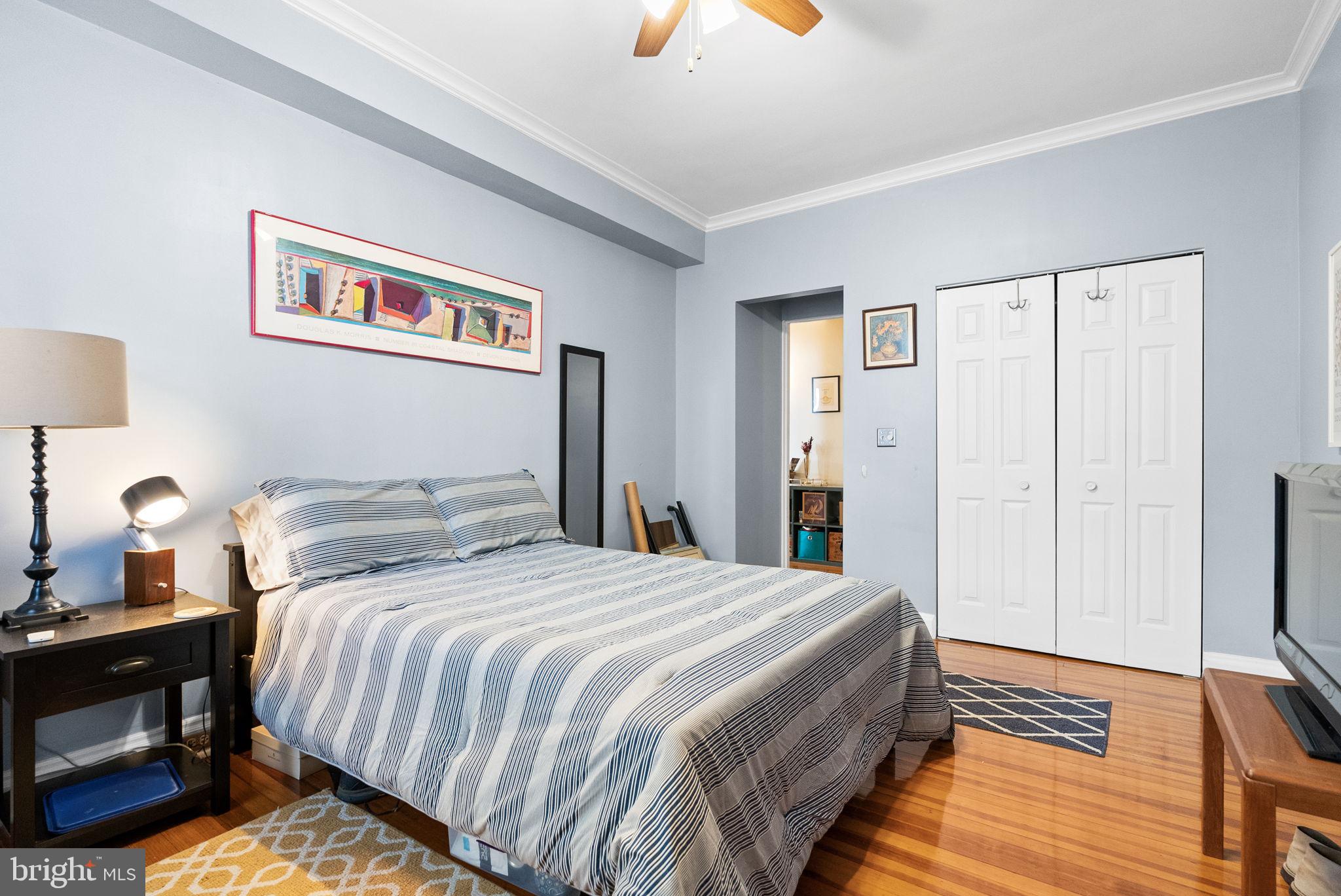 3405 Greenway, Unit 302 Baltimore, MD 21218 - Photo 24 of 42 a bedroom with bed and a night stand