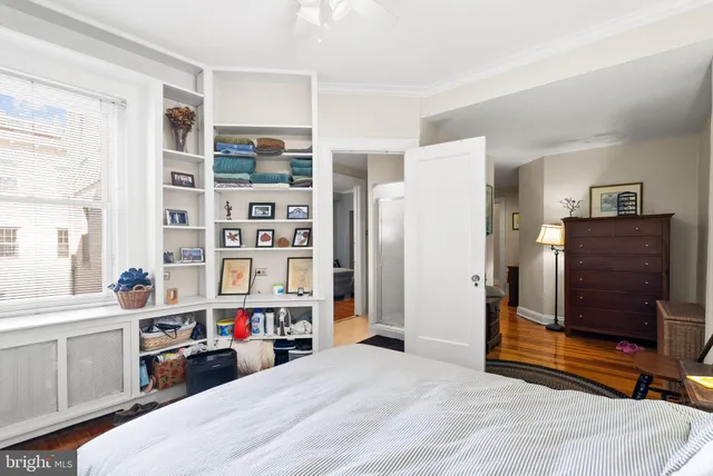 a bed room with a bed and a television