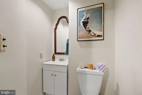 a room with a sink and a mirror